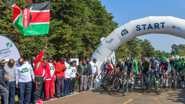 Principal Secretary for Mining Harry Kimutai and Dr. Chris Kiptoo waves the Kenyan flag to officially start the 2026 Kaptagat Cycling Challenge.