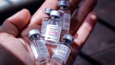 Vials of retatrutide held in a hand, representing the weight-loss peptide's growing use in Kenya
