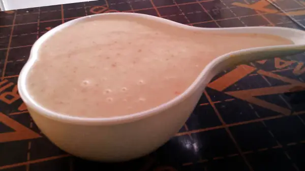 A calabash bowl of uji power served at a Kenyan restaurant